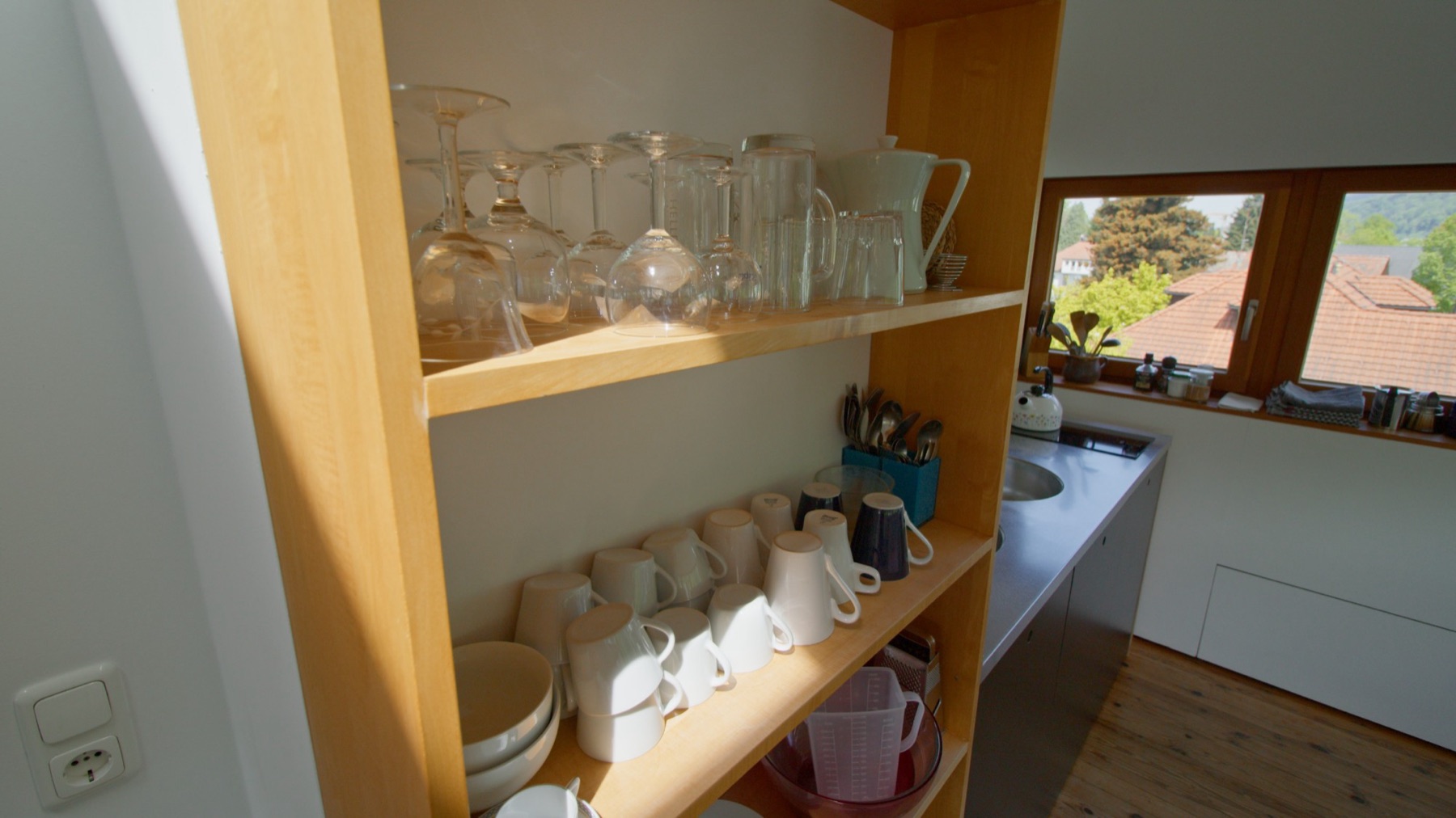 Kitchen shelf with tableware and glasses